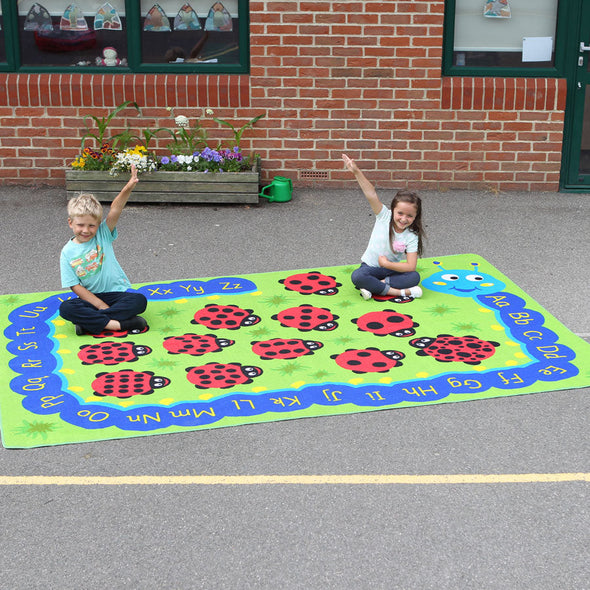 Back to Nature™ Chloe Caterpillar Outdoor Play™ Mat W3000 x D2000mm Back to Nature™ Counting Ladybird Outdoor Play™ Mats | Numeracy Carpets & Rugs | www.ee-supplies.co.uk